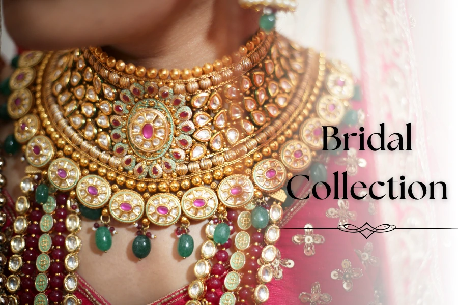 Close-up of an ornate gold bridal necklace with gems and the text "Bridal Collection".