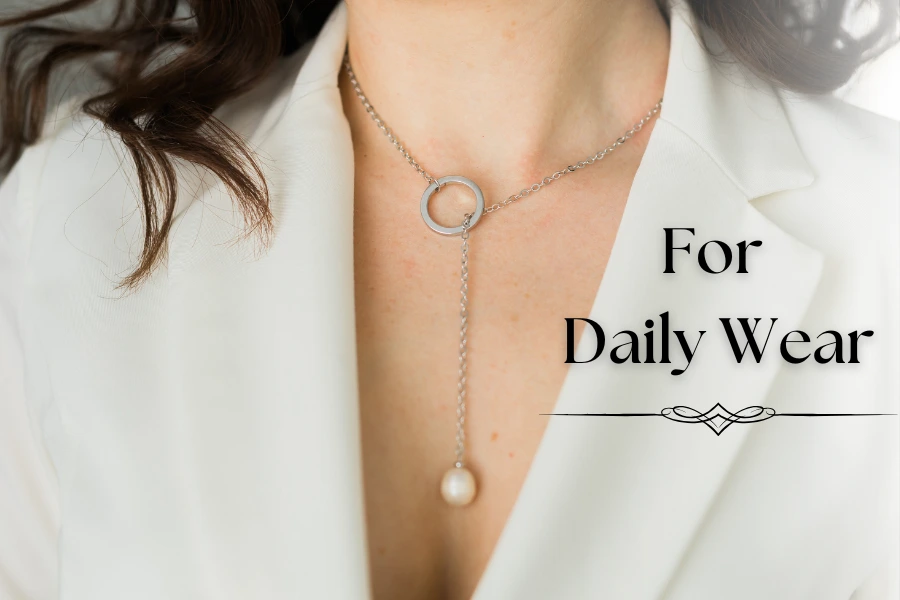 Woman wearing a pearl pendant lariat necklace with the text "For Daily Wear".