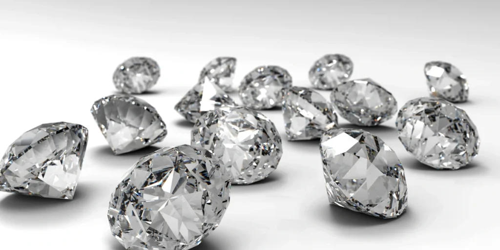  American Diamonds, scattered on a smooth, white surface.