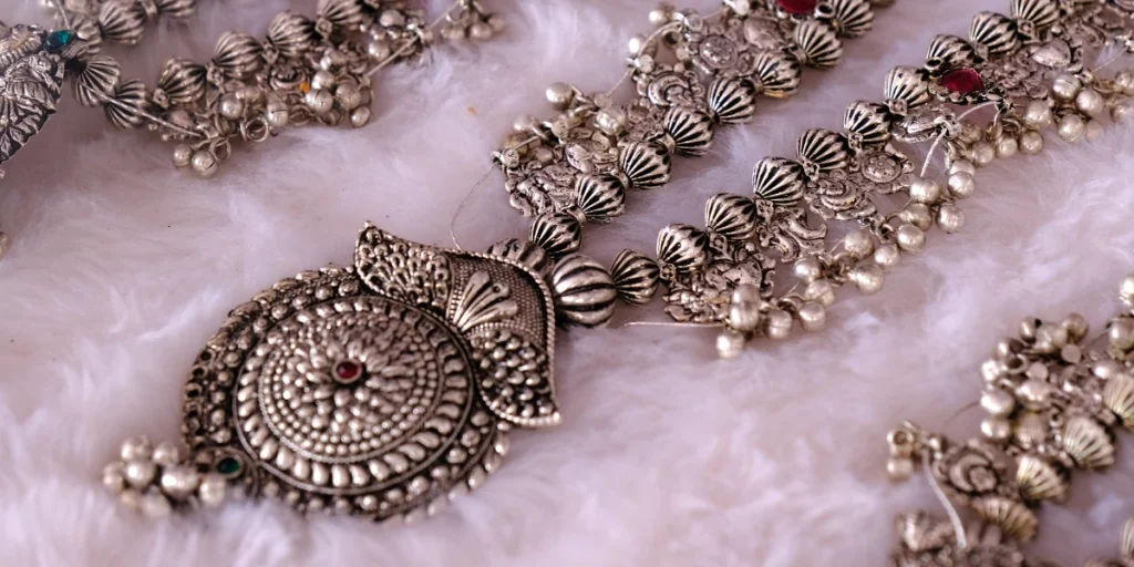 a close up view of a necklace with an ornate design